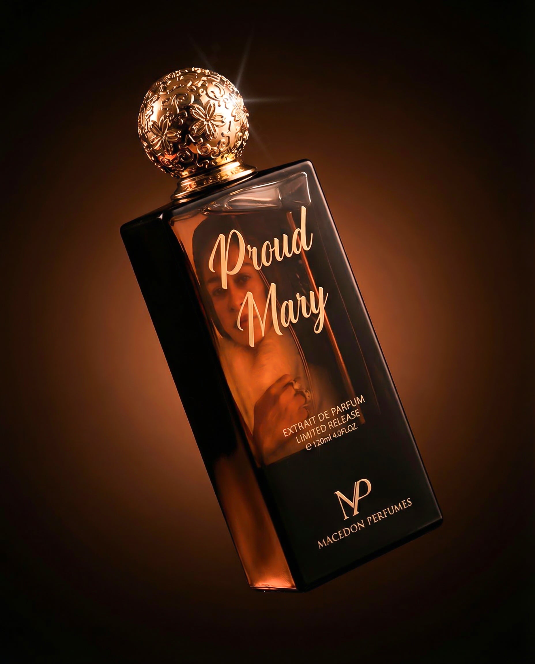 Perfume bottle with gold cap on a dark background